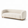 Sofá de 3 plazas curvo beige con tela bouclé y estructura de madera